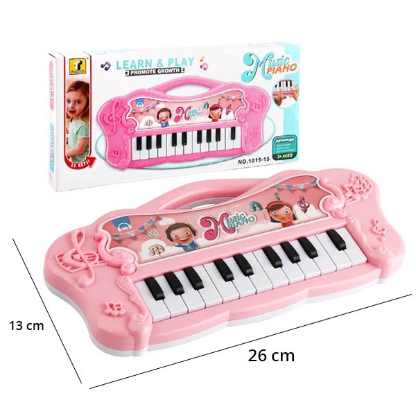 Piano rose pour bébé mesurant 26 cm sur 13 cm, avec 14 touches noires et blanches, conçu pour éveiller la créativité musicale des tout-petits.