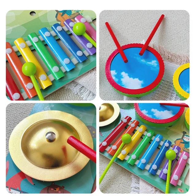 Table d'éveil musicale avec xylophone coloré, tambours et cymbale, parfait pour stimuler l'apprentissage musical des enfants.