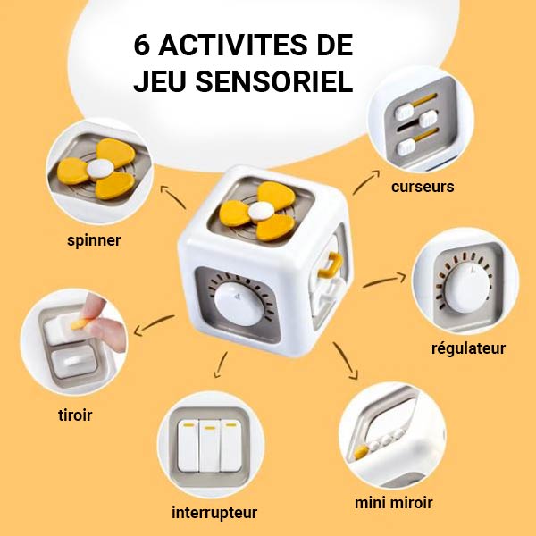 Cube sensoriel montessori avec six activités interactives, incluant un spinner, des curseurs, un régulateur, un miroir, des interrupteurs et un tiroir, favorisant l'éveil sensoriel et la motricité fine.